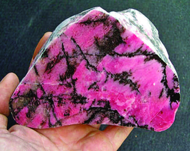 Pink rhodonite patterned with black veinlets and dendrites of secondary manganese from Tamworth, New South Wales (courtesy Barry Kayes)