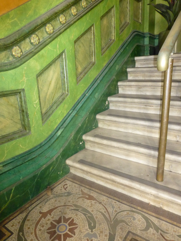 Faux marble wall, marble staircase and mosaic floor tiles 